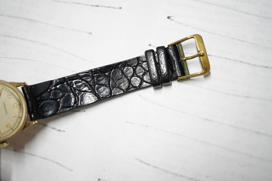 A boy's size 1940's 10k gold filled Longines manual wind wrist watch, with Arabic dial and subsidiary seconds cased and timed in the U.S.A., case diameter 28mm, movement c.10L, on an associated leather strap.